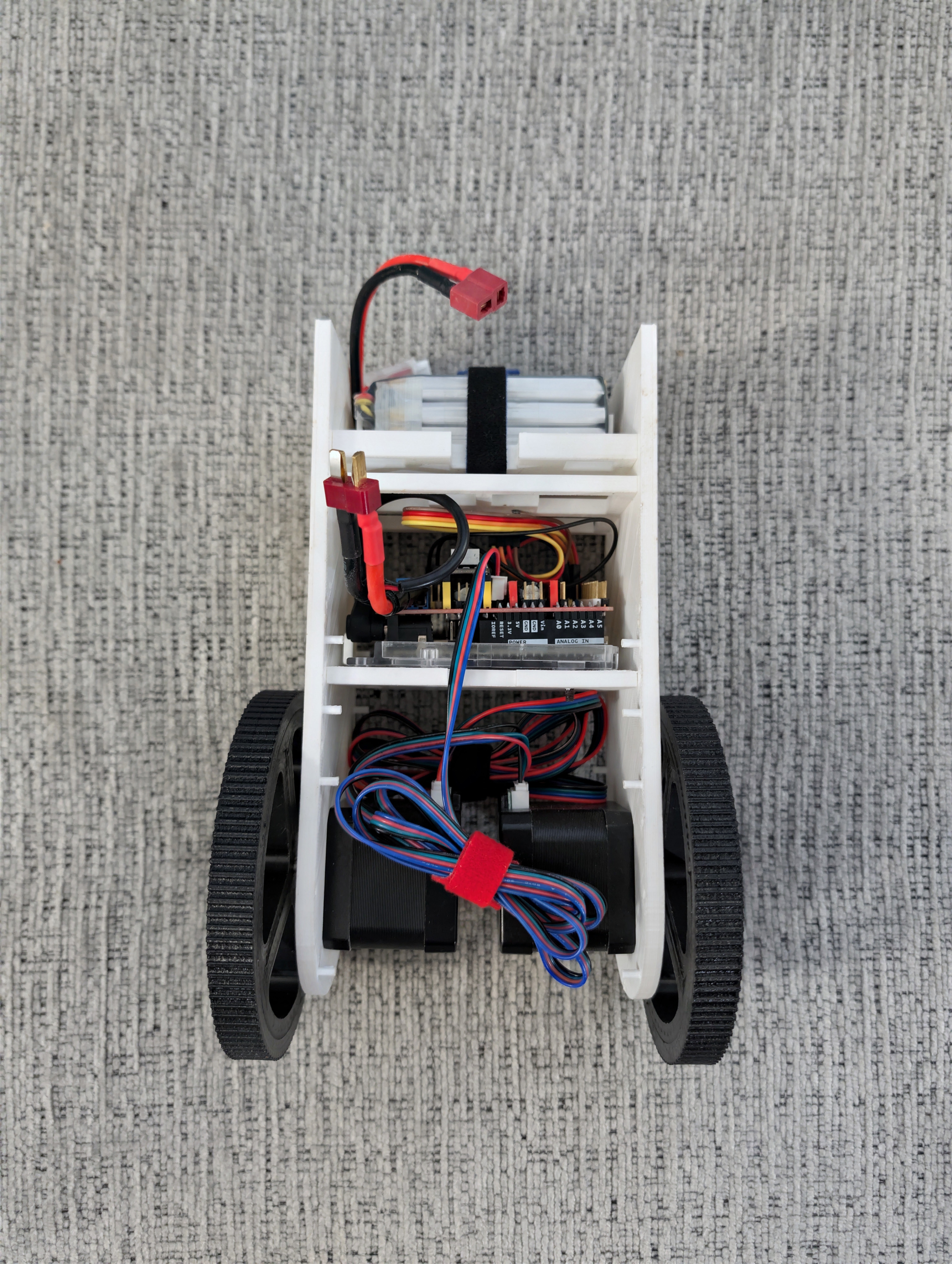 Self-balancing robot laid down with its internal components visible